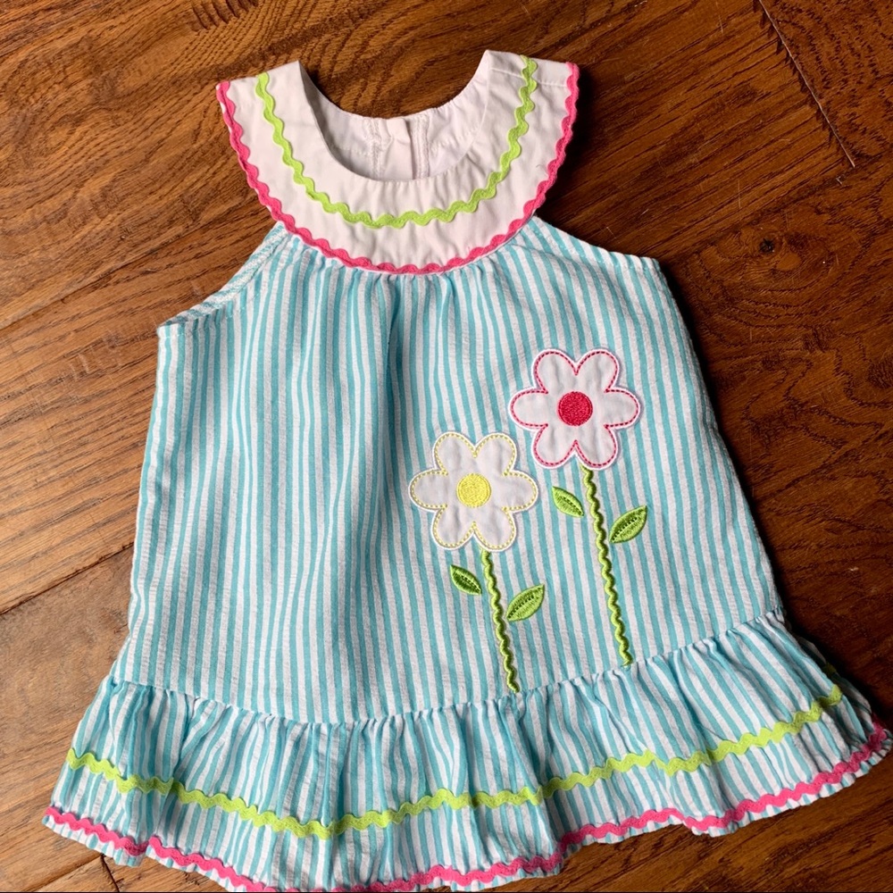 Blue seersucker, rickrack, and flower dress